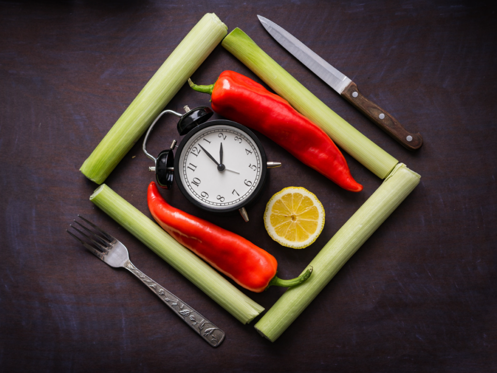 vegetables places around a clock with a fork and knife - signs you have an unhealthy relationship with food - dieting and food rules
