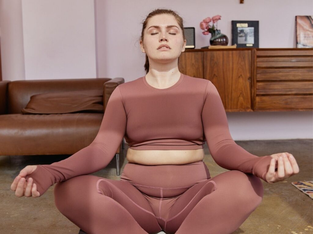 woman sitting meditation showing the intuitive eating results for her mental and physical health